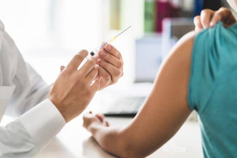 Injection Being Prepared To Be Placed In A Patients Arm